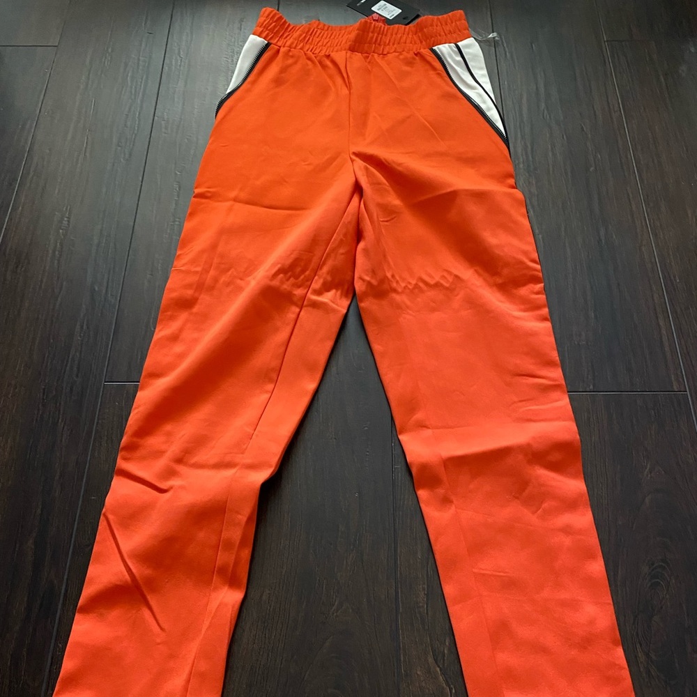 Tapered trouser pants with button leg closure